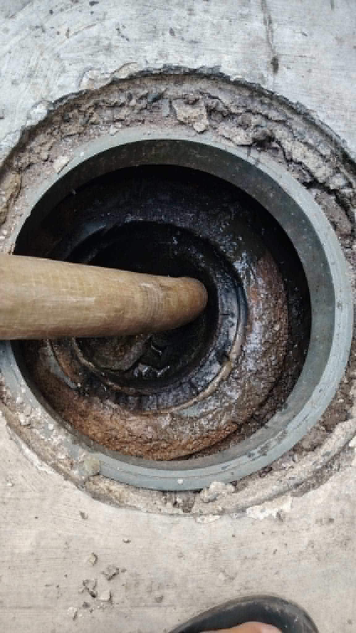 Close-up of a cleared septic access pipe